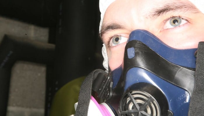 Asbestos Surveyor wearing mask in Wales